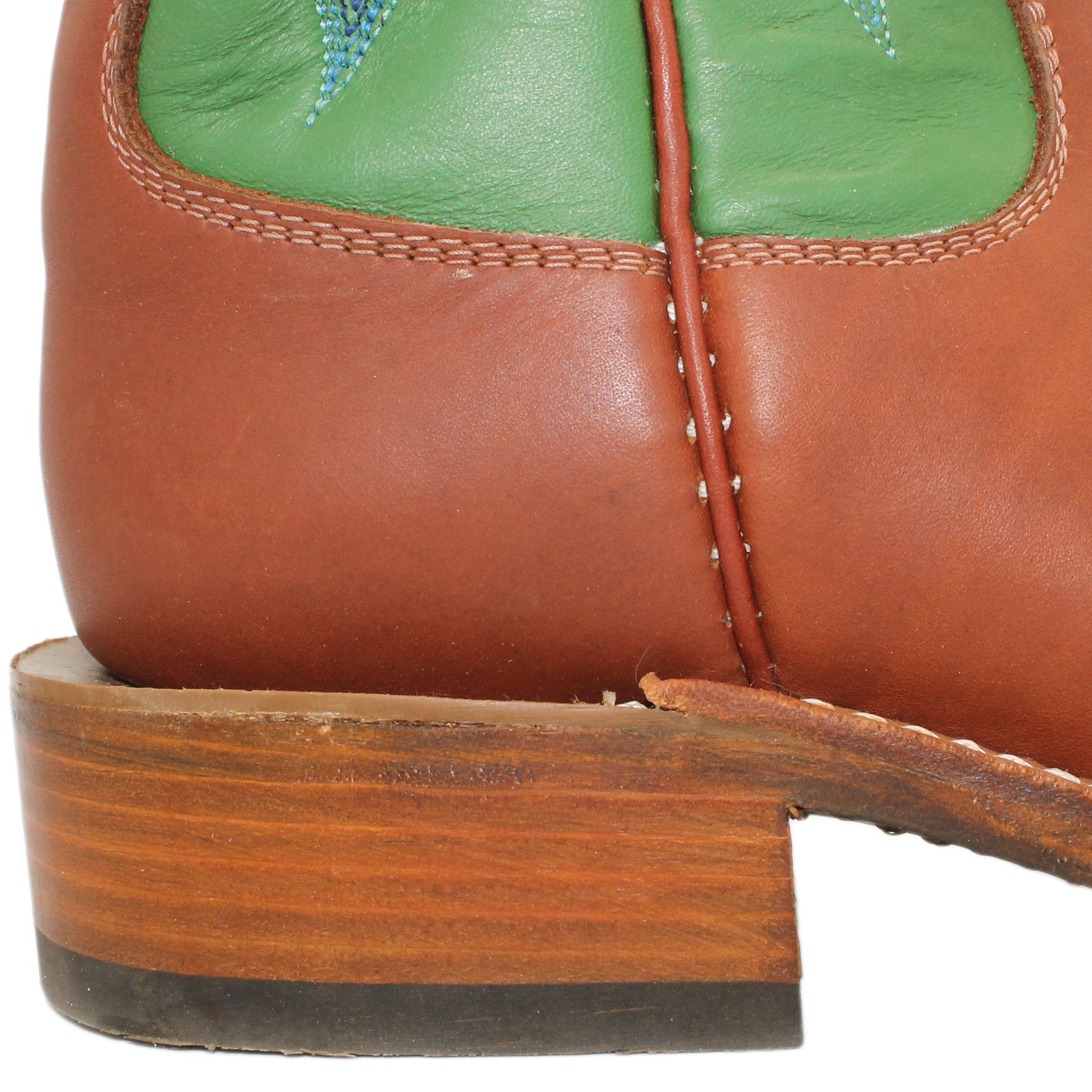 12" Green upper w/ Beck 5 Row Stitching
Tan Timberjack Steer Vamp
Wide Round Toe
Block Heel
Leather Sole